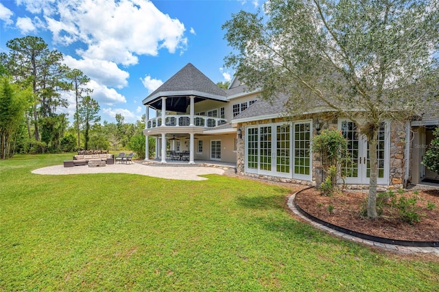 5366 N Lake Farms Rd, De Leon Springs, FL 32130 - rear view of house featuring an outdoor hangout area, a ceiling fan, a patio area, and stone siding