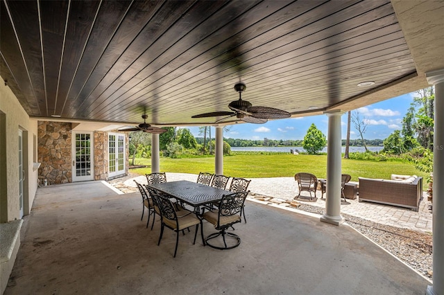 5366 N Lake Farms Rd, De Leon Springs, FL 32130 - view of patio with a water view, a ceiling fan, and outdoor dining space