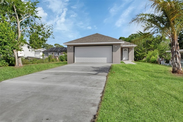 1226 N St, Daytona Beach, FL 32114 - ranch-style home with stucco siding, a front yard, driveway, a garage, and a shingled roof
