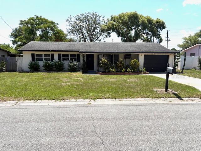 3 Cassia Ln, Debary, FL 32713 - ranch-style house with a garage and concrete driveway