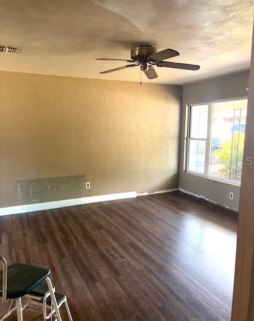 3 Cassia Ln, Debary, FL 32713 - empty room featuring baseboards, wood finished floors, and ceiling fan