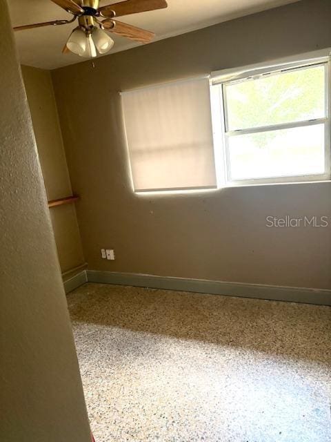 3 Cassia Ln, Debary, FL 32713 - unfurnished room featuring healthy amount of natural light, baseboards, speckled floor, and ceiling fan