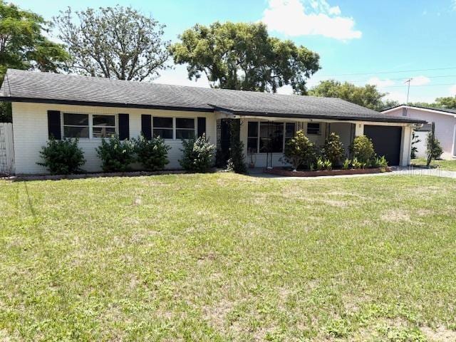 3 Cassia Ln, Debary, FL 32713 - ranch-style home featuring an attached garage and a front lawn