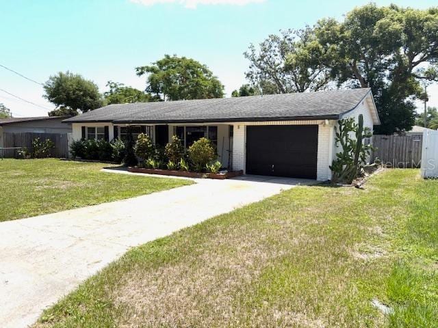 3 Cassia Ln, Debary, FL 32713 - ranch-style house featuring an attached garage, driveway, and brick siding