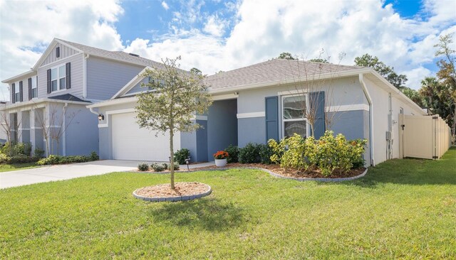 1671 Pecorino Ct, Titusville, FL 32780 - view of front of home with driveway, a front lawn, an attached garage, and stucco siding