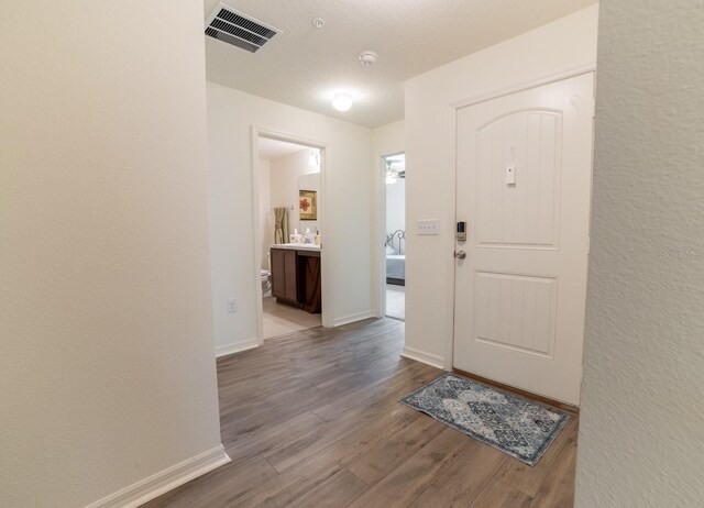 1671 Pecorino Ct, Titusville, FL 32780 - entrance foyer featuring wood finished floors and baseboards