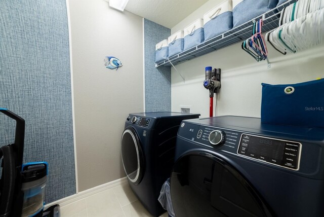 1671 Pecorino Ct, Titusville, FL 32780 - washroom featuring washer and dryer, light tile patterned flooring, and baseboards