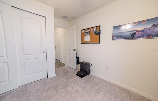 1671 Pecorino Ct, Titusville, FL 32780 - unfurnished bedroom with carpet flooring, a closet, and baseboards