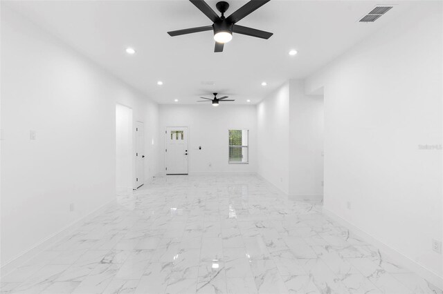 1163 W Hancock Dr, Deltona, FL 32725 - unfurnished living room with a ceiling fan, recessed lighting, and light marble finish floors