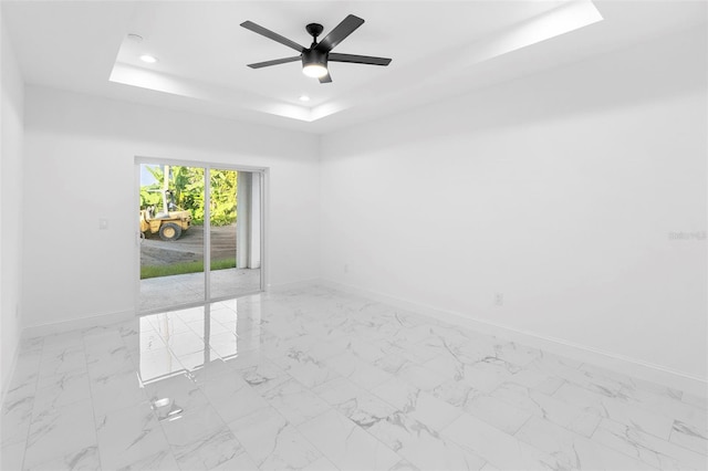 1163 W Hancock Dr, Deltona, FL 32725 - spare room with a raised ceiling, recessed lighting, ceiling fan, and marble finish floors