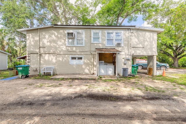 449 3rd St, Daytona Beach, FL 32117 - back of property with separate washer and dryer and cooling unit