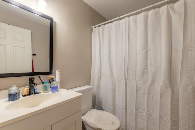 449 3rd St, Daytona Beach, FL 32117 - bathroom with vanity, toilet, and a shower with shower curtain