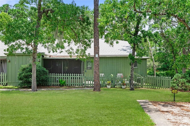 view of yard featuring a sunroom