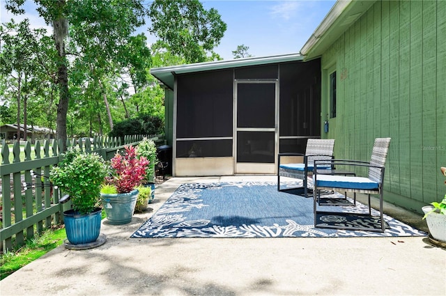 view of patio / terrace with a sunroom