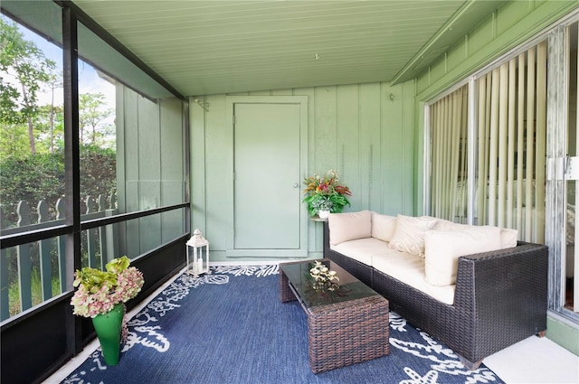 sunroom / solarium featuring outdoor lounge area