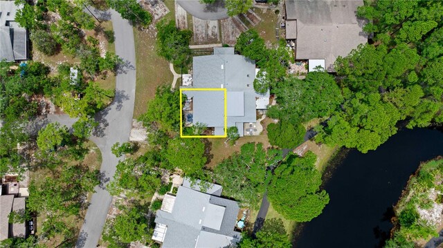 aerial perspective of suburban area featuring a large body of water and property parcel outlined