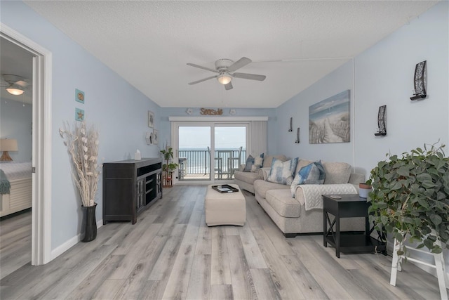 2222 Ocean Shore Blvd Unit 304B, Ormond Beach, FL 32176 - living area with a ceiling fan and light wood-style floors