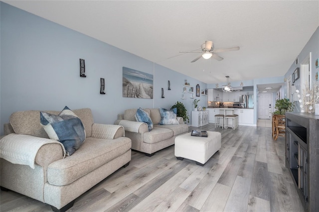 2222 Ocean Shore Blvd Unit 304B, Ormond Beach, FL 32176 - living area with a ceiling fan and light wood finished floors