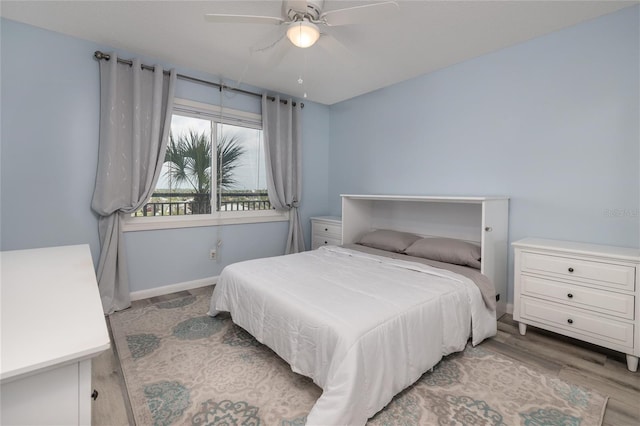2222 Ocean Shore Blvd Unit 304B, Ormond Beach, FL 32176 - bedroom with wood finished floors and ceiling fan