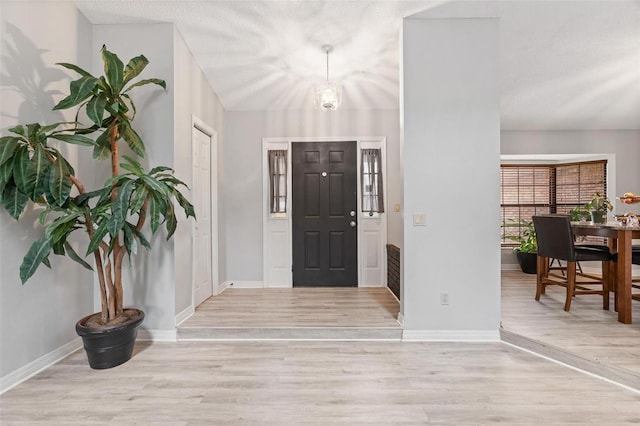 901 Vicksburg St, Deltona, FL 32725 - foyer entrance featuring wood finished floors and baseboards