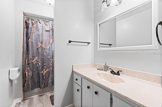 901 Vicksburg St, Deltona, FL 32725 - full bath featuring vanity, wood finished floors, baseboards, and a shower with shower curtain