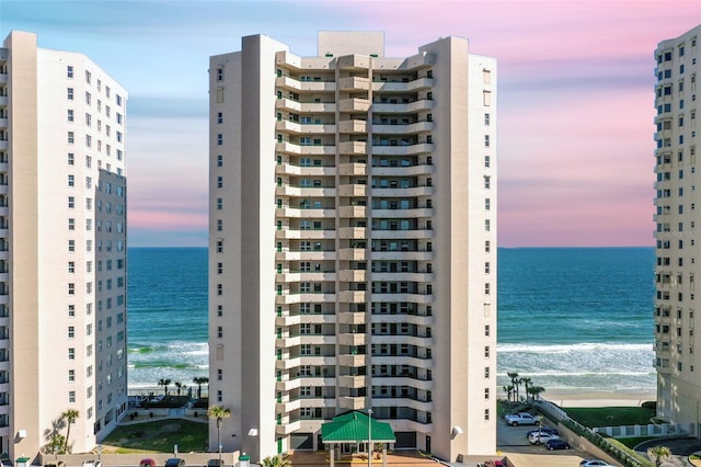 3315 S Atlantic Ave Unit 1406, Daytona Beach Shores, FL 32118 - property at dusk featuring a water view