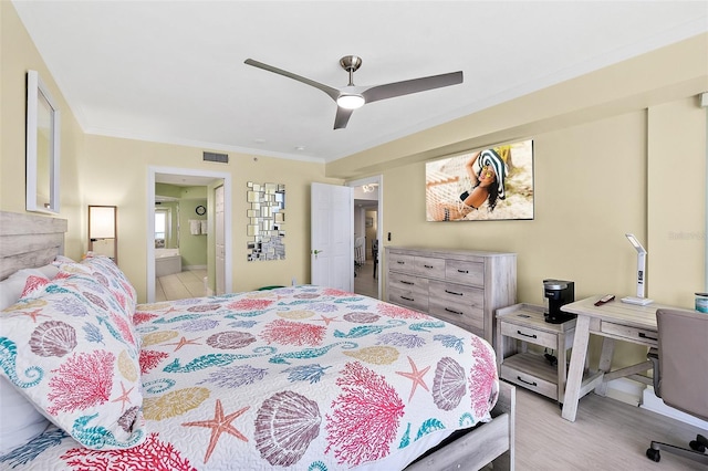 3315 S Atlantic Ave Unit 1406, Daytona Beach Shores, FL 32118 - bedroom with ornamental molding, wood finished floors, connected bathroom, and a ceiling fan