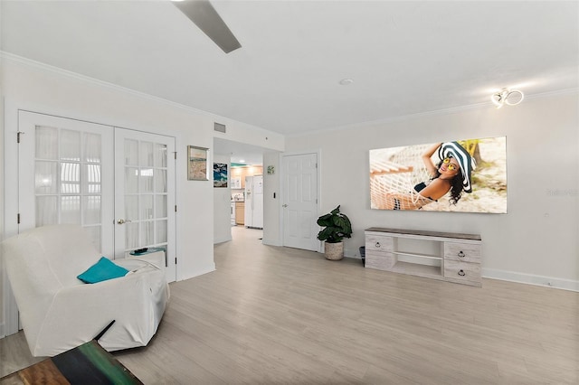 3315 S Atlantic Ave Unit 1406, Daytona Beach Shores, FL 32118 - sitting room featuring crown molding, wood finished floors, and baseboards