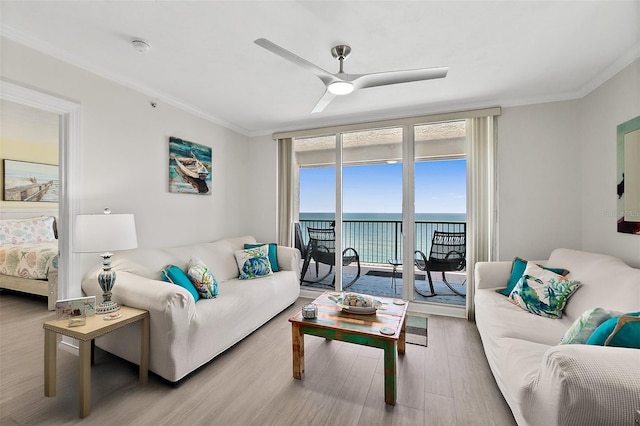 3315 S Atlantic Ave Unit 1406, Daytona Beach Shores, FL 32118 - living room featuring wood finished floors, ceiling fan, crown molding, and a water view