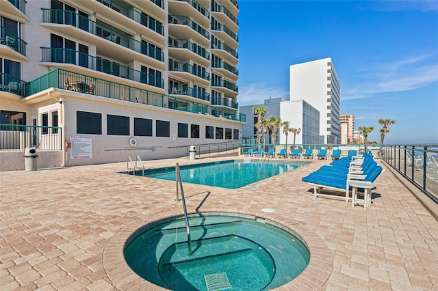 3315 S Atlantic Ave Unit 1406, Daytona Beach Shores, FL 32118 - community pool with a community hot tub and a patio