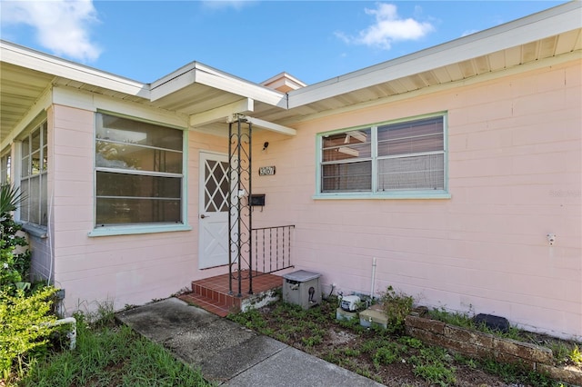 3267 S Peninsula Dr, Daytona Beach, FL 32118 - doorway to property with concrete block siding