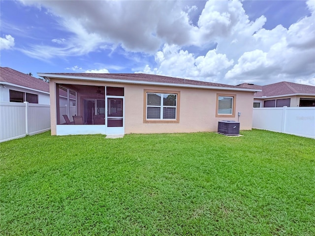 110 No Name Key Dr, Deland, FL 32720 - rear view of property with a sunroom, central AC unit, and stucco siding