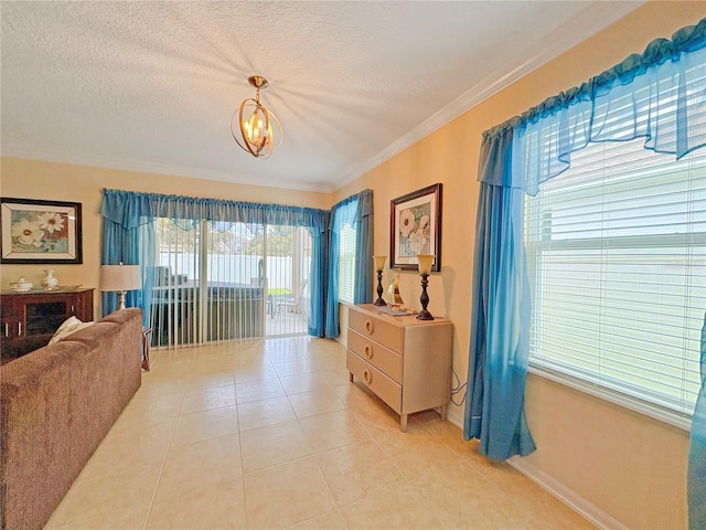 110 No Name Key Dr, Deland, FL 32720 - living area with ornamental molding, light tile patterned floors, a chandelier, a textured ceiling, and baseboards
