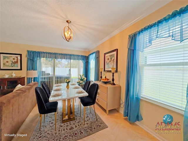 110 No Name Key Dr, Deland, FL 32720 - dining room featuring ornamental molding, baseboards, and a chandelier