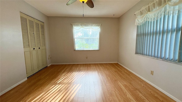 1301 Killian St, Daytona Beach, FL 32114 - unfurnished bedroom featuring wood finished floors, a closet, baseboards, and ceiling fan