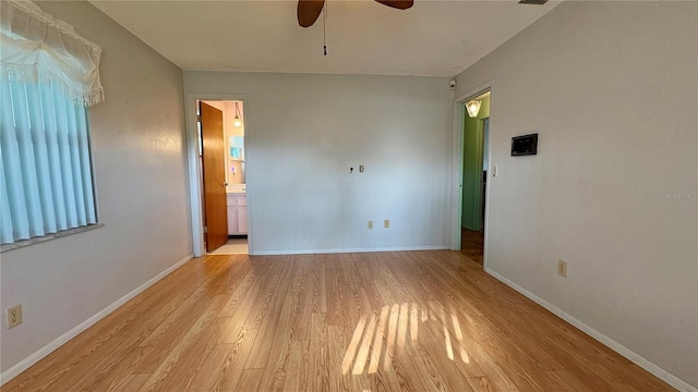 1301 Killian St, Daytona Beach, FL 32114 - empty room with ceiling fan, light wood finished floors, and baseboards