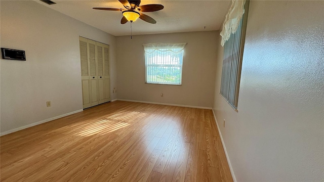 1301 Killian St, Daytona Beach, FL 32114 - unfurnished bedroom with baseboards, light wood-style floors, a ceiling fan, and a closet