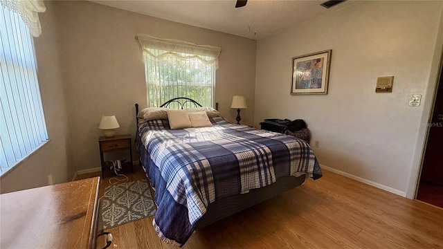 1301 Killian St, Daytona Beach, FL 32114 - bedroom with wood finished floors, baseboards, and a ceiling fan