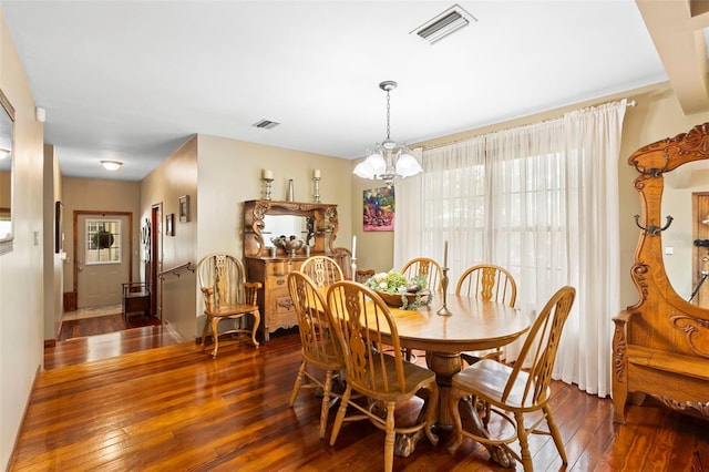 1056 Reynolds Rd, De Leon Springs, FL 32130 - dining area with hardwood / wood-style floors and a chandelier
