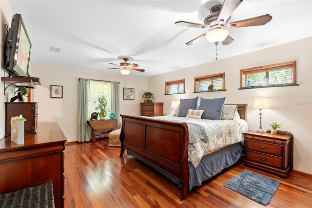 1056 Reynolds Rd, De Leon Springs, FL 32130 - bedroom featuring wood finished floors, baseboards, and a ceiling fan