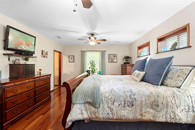 1056 Reynolds Rd, De Leon Springs, FL 32130 - bedroom with dark wood finished floors and ceiling fan