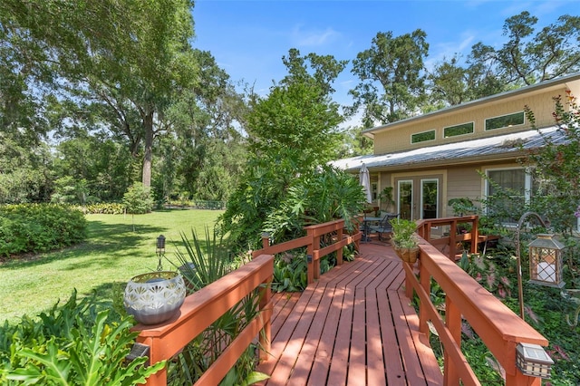1056 Reynolds Rd, De Leon Springs, FL 32130 - wooden terrace with french doors and a yard