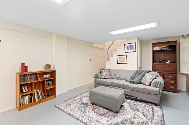 1056 Reynolds Rd, De Leon Springs, FL 32130 - living area with stairway, concrete flooring, and baseboards