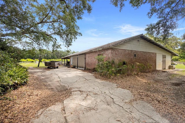 1056 Reynolds Rd, De Leon Springs, FL 32130 - view of side of property with brick siding