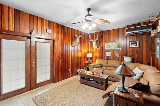 1056 Reynolds Rd, De Leon Springs, FL 32130 - tiled living area with an AC wall unit, a ceiling fan, wooden walls, and french doors