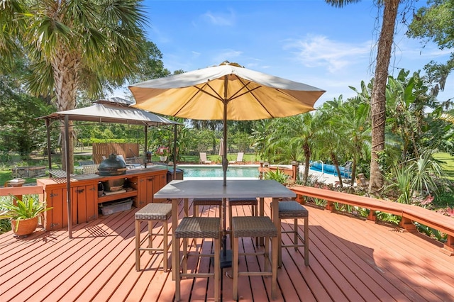 1056 Reynolds Rd, De Leon Springs, FL 32130 - wooden deck with a gazebo, an outdoor pool, a grill, and outdoor dining space