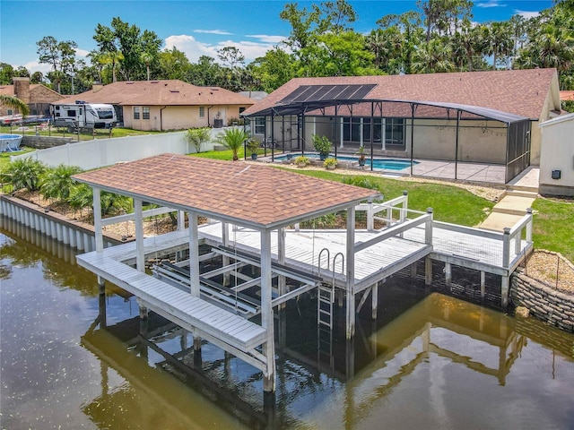 1520 Stone Trl, Enterprise, FL 32725 - dock with boat lift, a water view, and glass enclosure