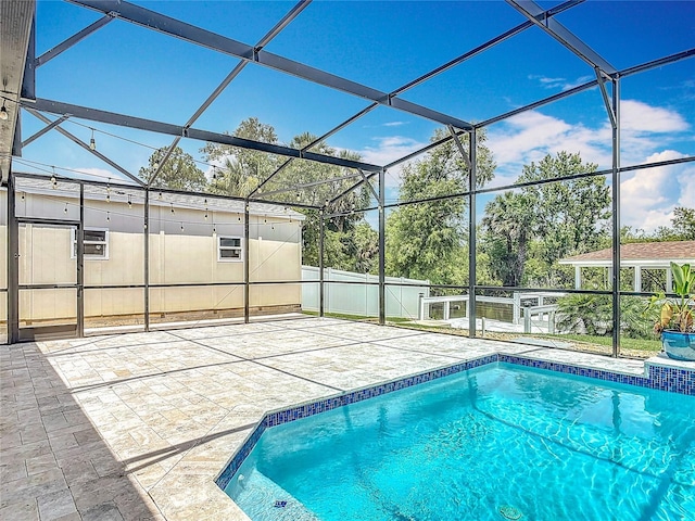 1520 Stone Trl, Enterprise, FL 32725 - outdoor pool with a patio and glass enclosure