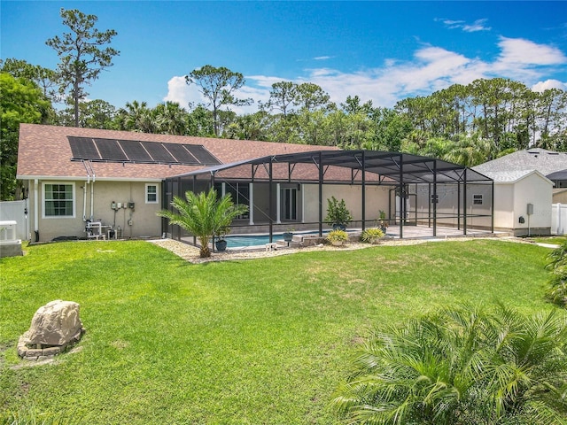 1520 Stone Trl, Enterprise, FL 32725 - back of house featuring solar panels, an outdoor pool, stucco siding, roof with shingles, and a lanai
