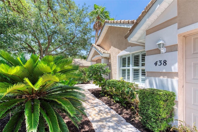 438 Harbour Town Ln, Ormond Beach, FL 32174 - view of home's exterior with stucco siding and a tile roof